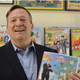 Really Big Coloring Books Publisher Wayne Bell holding up the Ted Cruz coloring book
YouTube